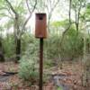 Several duck nesting boxes are located in the wooded area of the park.