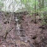 Rains create cascading water over the rocks in the park.  